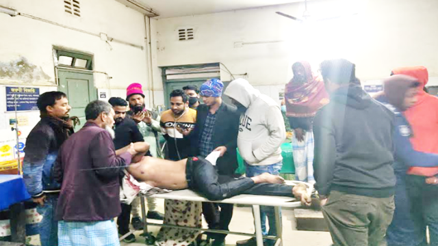This photo taken on January 4, 2024 shows Awami League activists rushing Dalim Sarkar, critically injured during pre-poll violence in the Badura area under Sadar upazila in Munshiganj district, to hos